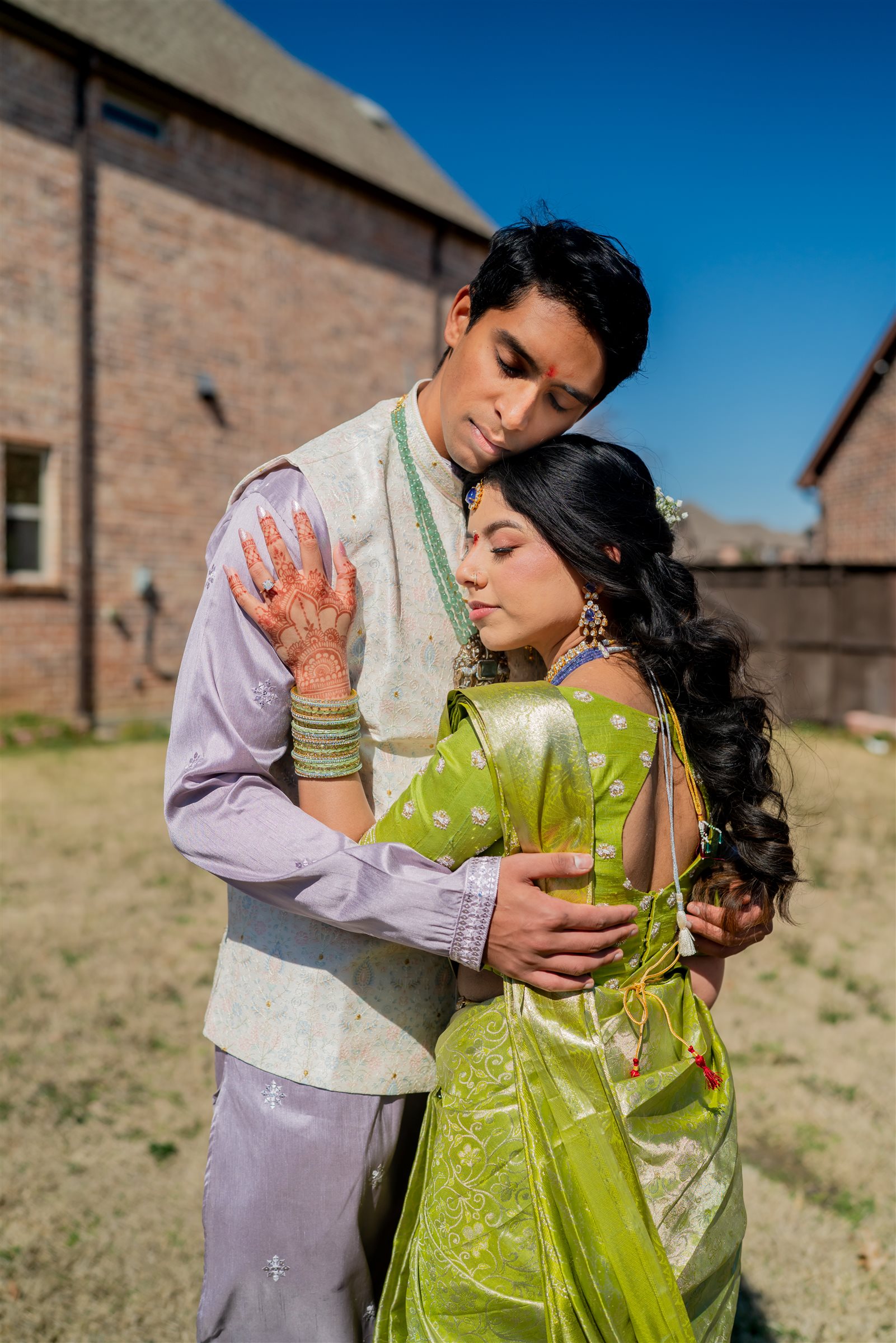 Meghana and her partner sharing a quiet embrace